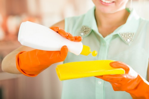 Team applying a health and safety policy during routine cleaning work